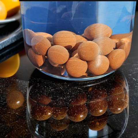 Billes QELBY au fond d'un bocal en verre